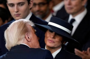 Steely and mysterious: Melania Trump’s look sparks nods to Carmen Sandiego, the iconic fictional globe-trotting thief in red